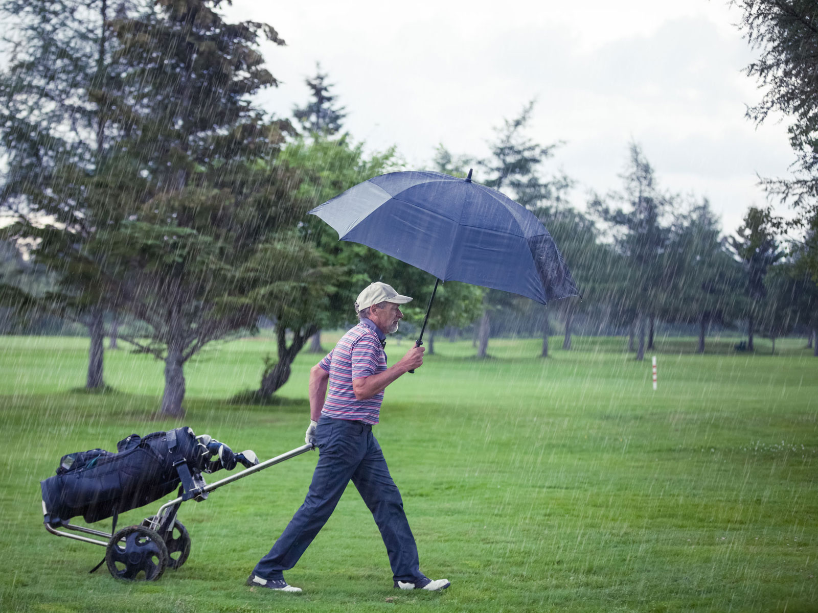 Golfer in the rain