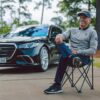 Bernhard Langer seated beside a bespoke Mercedes-Benz S-Class at Augusta during the 2026 Masters