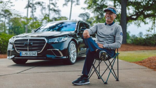 Bernhard Langer seated beside a bespoke Mercedes-Benz S-Class at Augusta during the 2026 Masters
