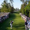 Rory McIlroy tees off at Augusta National during the 2025 Masters with a gallery lining the fairway