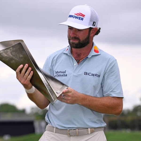 Cameron Young holds the Cadillac Championship trophy after his win at Doral.