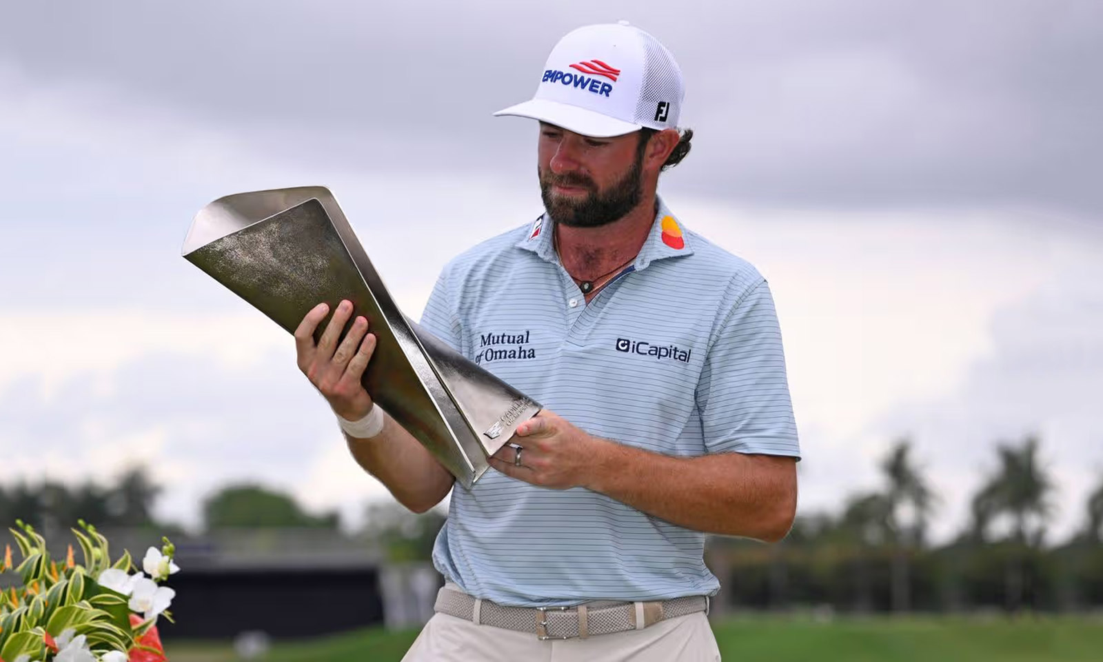Cameron Young holds the Cadillac Championship trophy after his win at Doral.