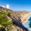 Aerial view of Quivira Golf Club in Los Cabos, showing a dramatic cliffside golf hole overlooking the Pacific Ocean and Baja coastline.