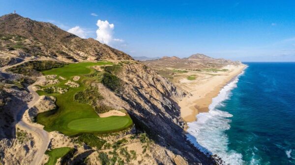 Aerial view of Quivira Golf Club in Los Cabos, showing a dramatic cliffside golf hole overlooking the Pacific Ocean and Baja coastline.