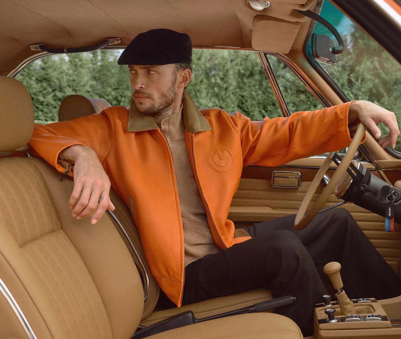 The Kith and BMW restored 1972 3.0 CSi and 1987 M6 E24 in Inka Orange fashion collection